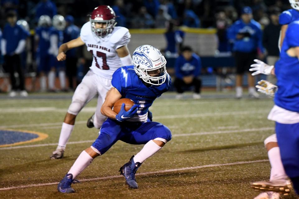 Fillmore's Diego Amezcua cuts back against the Santa Paula defense during the teams' Citrus Coast League game at Fillmore High on Friday, Oct. 28, 2022. Fillmore won 35-28 to secure the outright league championship in the 112th meeting between the rival schools.