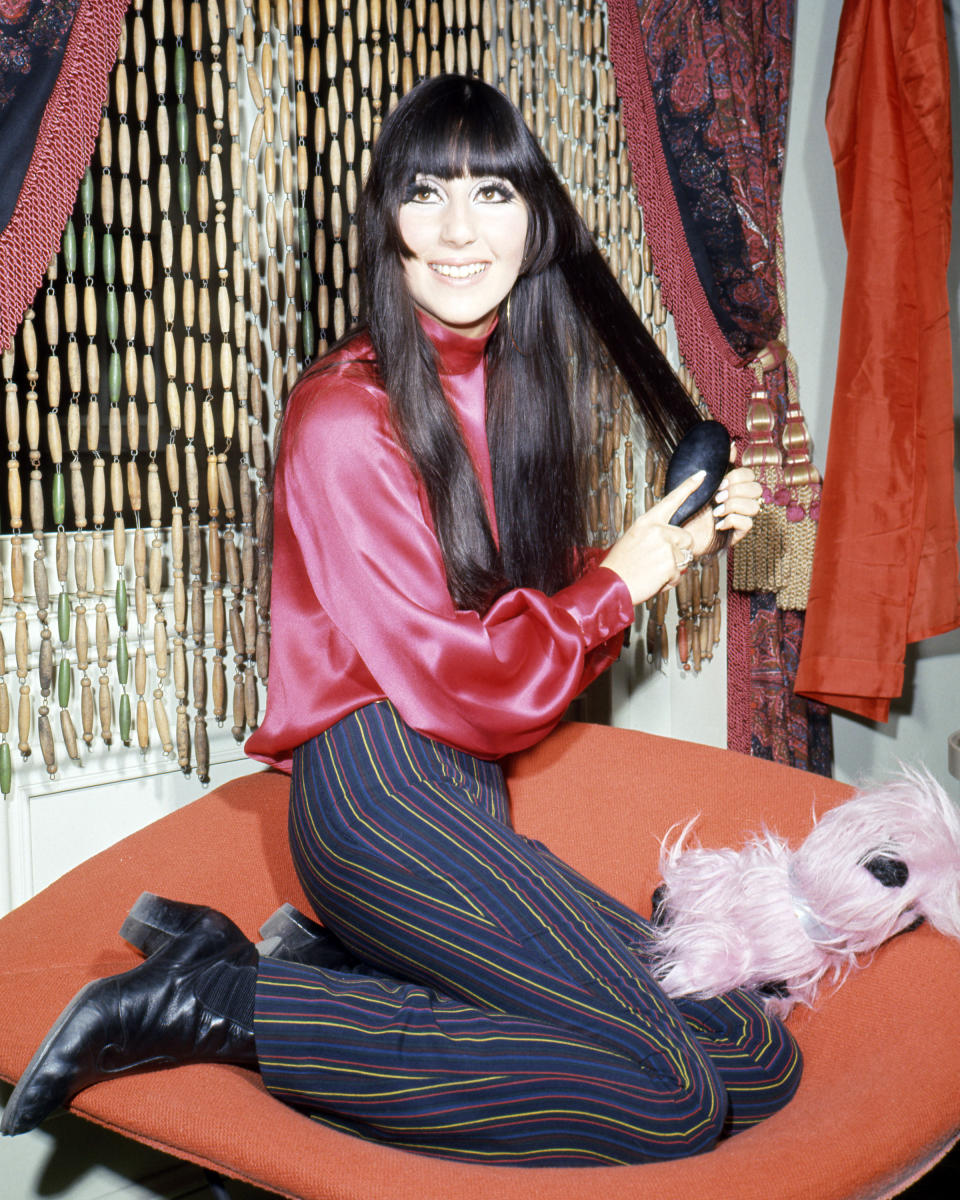 American pop singer and actress Cher brushing her hair, circa 1968. (Photo by Silver Screen Collection/Getty Images)