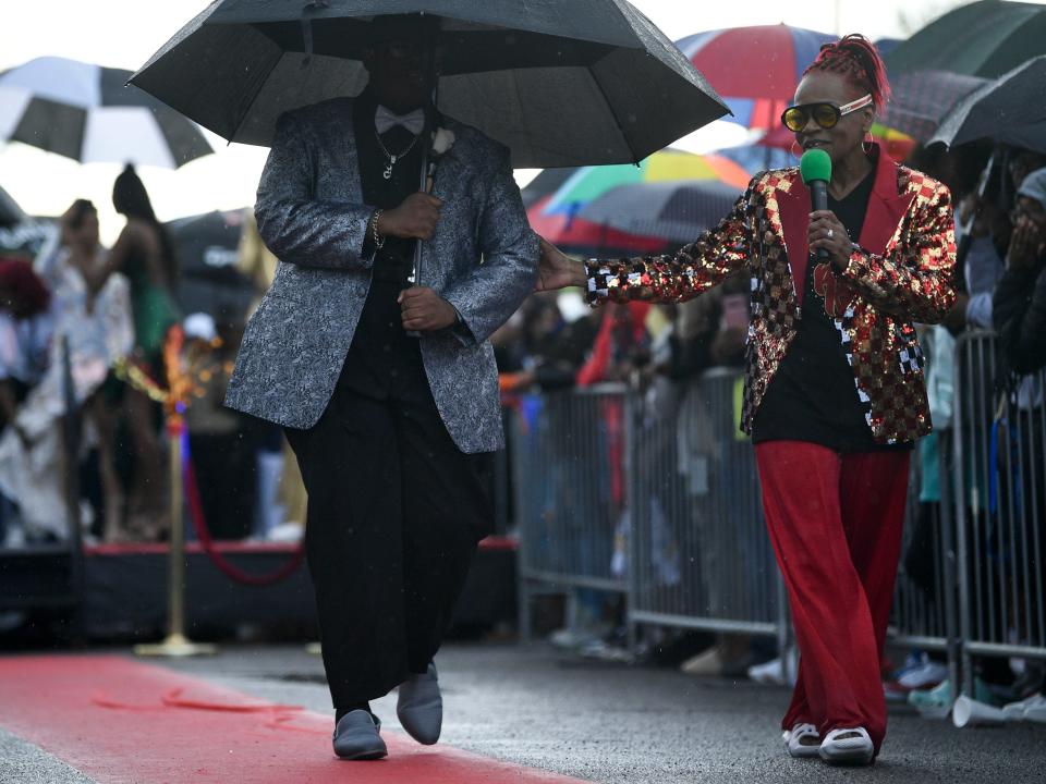 Yvette Rice accompanies an Austin-East student as the 2023 emcee and producer of the Pre-Prom Stop.