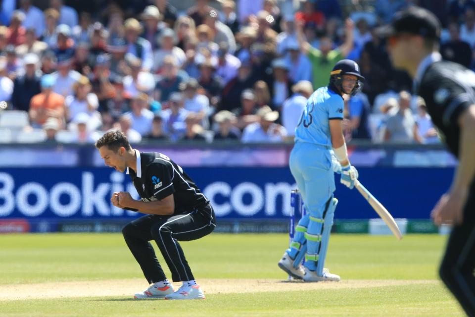 New Zealand's Trent Boult (L) celebrates the wicket of England's Jos Buttler (C) for 11 runs during the 2019 Cricket World Cup group stage match between England and New Zealand at the Riverside Ground, in Chester-le-Street, northeast England, on July 3, 2019. (Photo by Lindsey Parnaby / AFP) / RESTRICTED TO EDITORIAL USE        (Photo credit should read LINDSEY PARNABY/AFP/Getty Images)