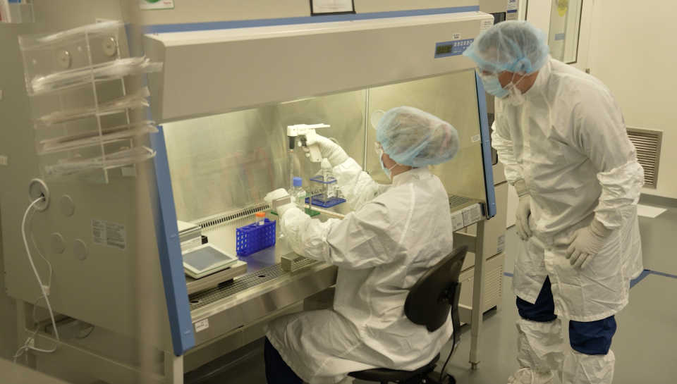 Moderna employees manufacture personalized cancer vaccines at the company's facility in Norwood, Massachusetts