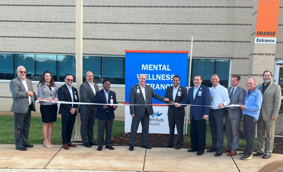 Leaders from Meritus Health, Brook Lane Health Services and state and local representatives celebrate the opening of the Mental Health Walk-In Care facility and expansion of the Meritus Crisis Center during a ribbon-cutting ceremony on the health system’s campus, Monday, Sept. 25. Pictured, from left, are: Washington County Commissioner Jeffrey Cline; Meritus Health Vice President of Legal Services Lynn Haines; Brook Lane Chief Medical Officer Dr. Michael Hann; Meritus Health Vice President of Team Member Services Scott Salzetti; Meritus Health Chief Medical Officer Dr. Anand Budi; Brook Lane CEO Jeffrey O’Neal; Meritus Health President and CEO Maulik Joshi; Meritus Health Executive Director of Behavioral and Community Health Allen Twigg; Meritus Health Director of Behavioral Health Michael Smith; state Sen. Paul Corderman, R-Washington/Frederick; Meritus Health Peer Recovery Coach Curtis Meyer; and Washington County Chamber of Commerce President and CEO Paul Frey.