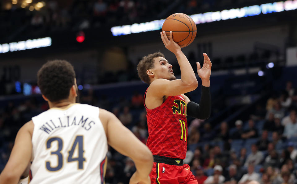 Atlanta Hawks guard Trae Young (11) shoots in the first half of an NBA basketball game against the New Orleans Pelicans in New Orleans, Tuesday, March 26, 2019. (AP Photo/Gerald Herbert)