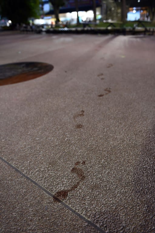 Bloody footprints are seen on the pavement at the Formosa Fun Coast amusement park after an explosion in the Pali district of New Taipei City early June 28, 2015