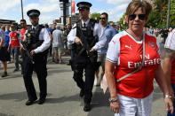 Armed police patrol outside Wembley Stadium in London on May 27, 2017 ahead of the English FA Cup final football match between Arsenal and Chelsea