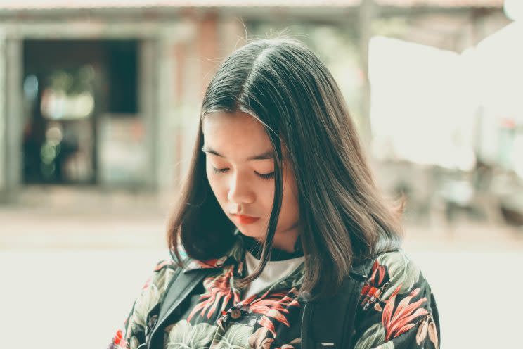 Woman looking at floor