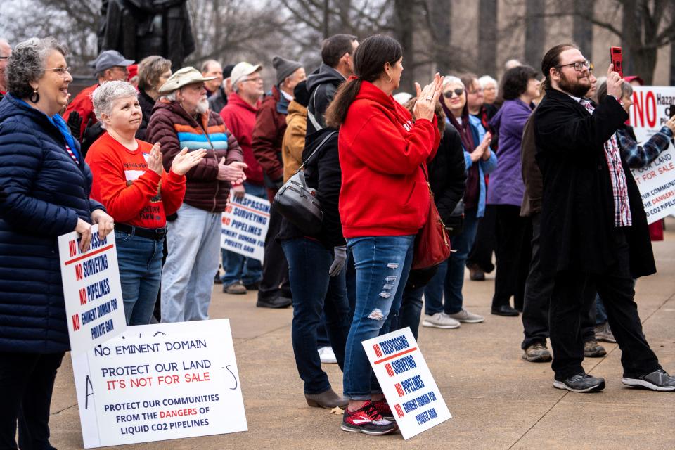 Opponents of carbon capture pipelines clap during a rally on Wednesday, March 22, 2023, at the Iowa State Capitol in Des Moines, Iowa.