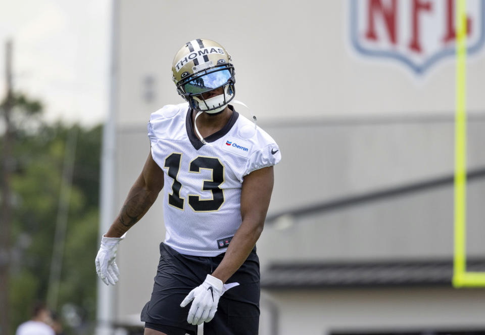 New Orleans Saints wide receiver Michael Thomas stands on the field during NFL football practice in Metairie, La., Tuesday, June 6, 2023. (Sophia Germer/The Times-Picayune/The New Orleans Advocate via AP)