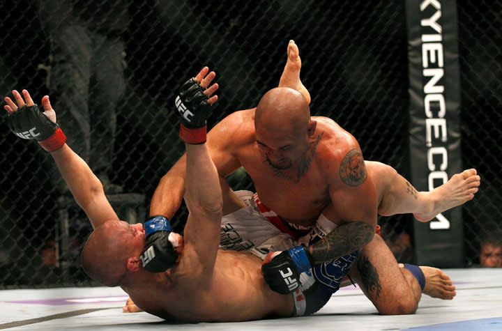 ATLANTA, GA - APRIL 21: Eddie Yagin (top) punches Mark Hominick during their featherweight bout for UFC 145 at Philips Arena on April 21, 2012 in Atlanta, Georgia.