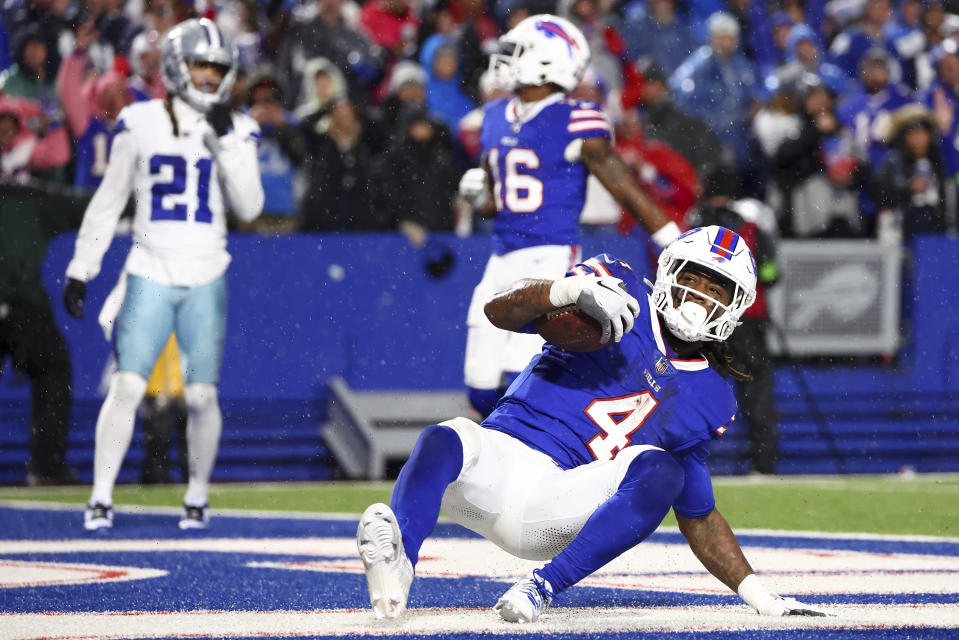 Buffalo Bills running back James Cook (4) scores a touchdown against the Dallas Cowboys during the fourth quarter of an NFL football game, Sunday, Dec. 17, 2023, in Orchard Park, N.Y. (AP Photo/Jeffrey T. Barnes)