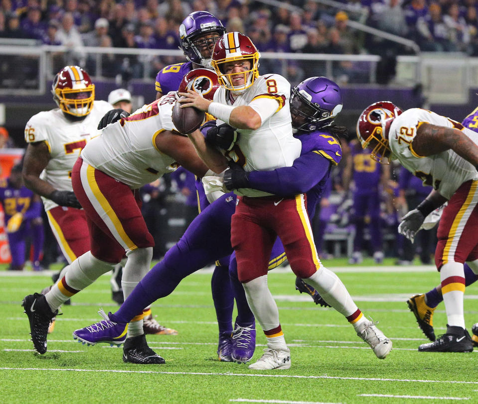 Case Keenum gets sacked by the Vikings in a loss Thursday night. (Getty Images)