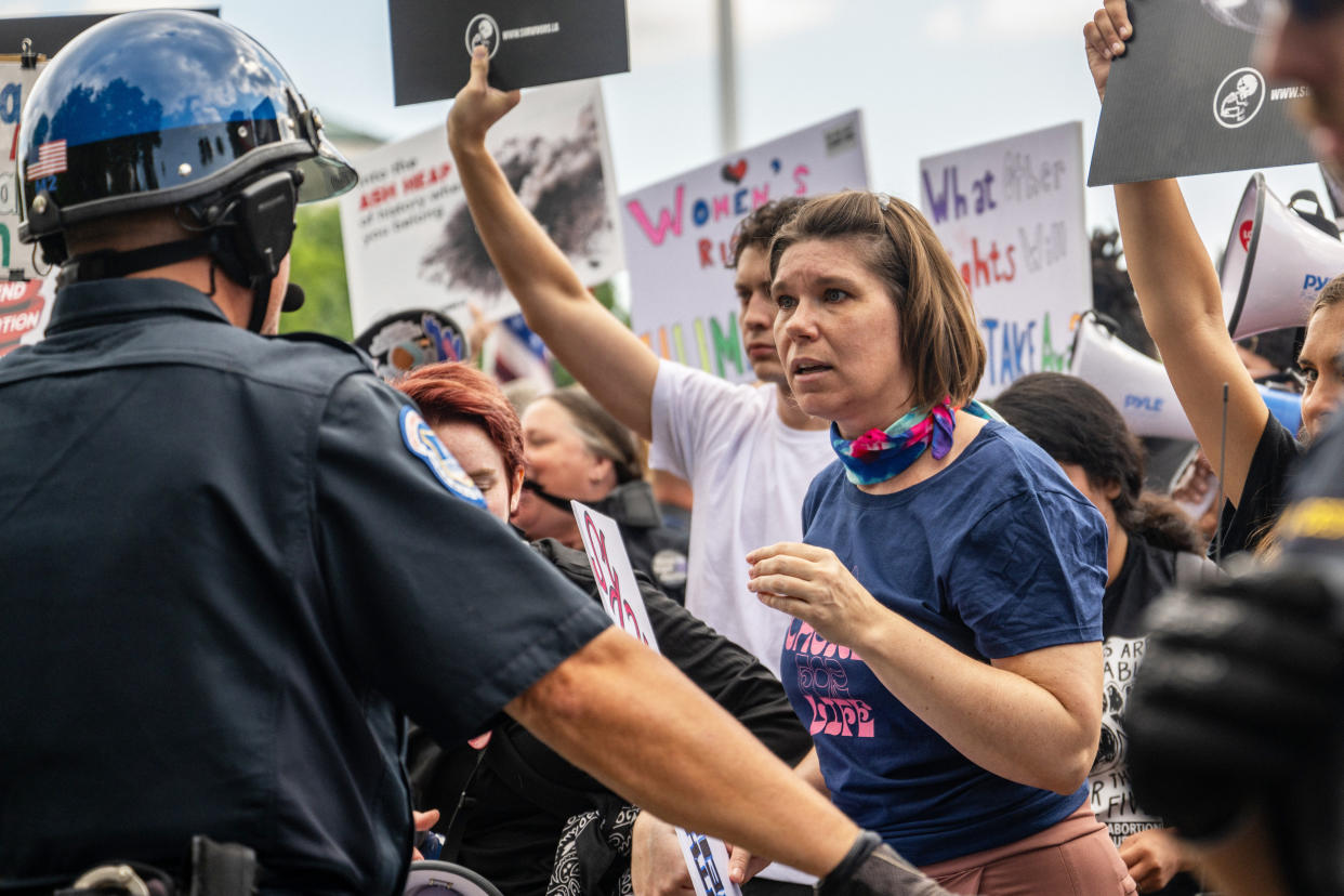 Demonstrators argue with law enforcement in front of the Supreme Court (Brandon Bell / Getty Images)