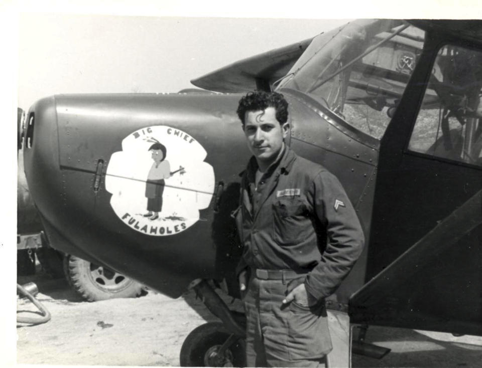 This undated photograph provided by American Airlines shows Azriel "Al" Blackman posing with an airplane while serving in the army during the Korean war. American Airlines is celebrating the 70-year service of a New York City mechanic who says he has no plans to retire. Azriel "Al" Blackman was 16 years old when he started as an apprentice mechanic in July of 1942. (AP Photo/American Airlines)