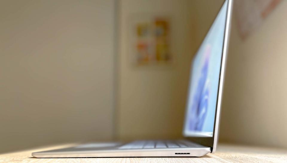 Surface Laptop 5 open with right side facing camera to show power port