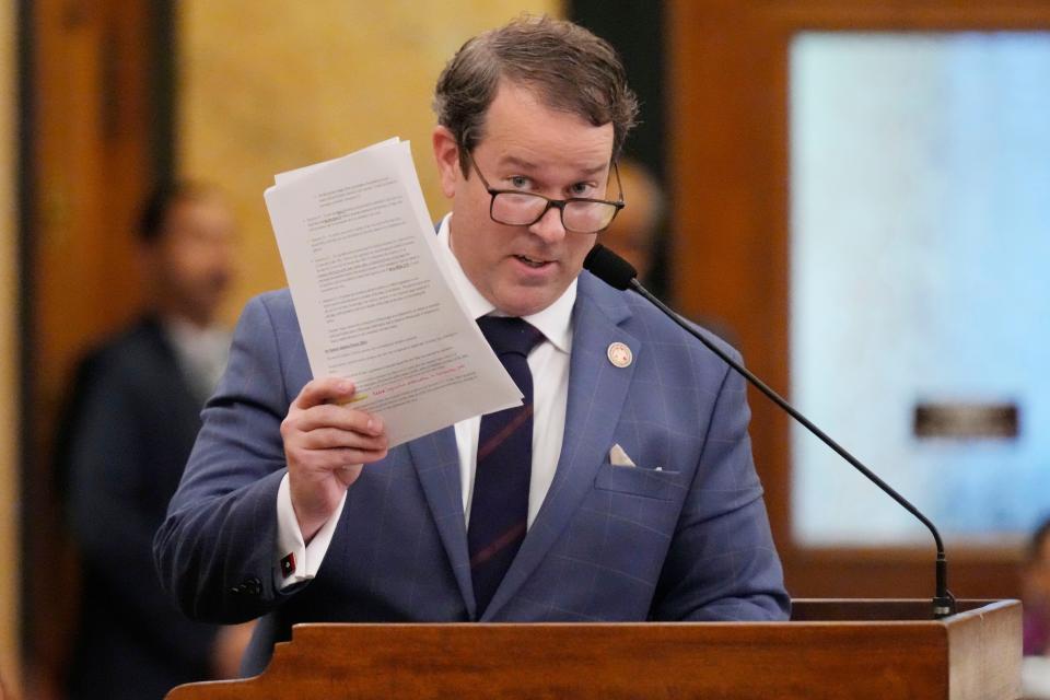 Mississippi State Rep. Fred Shanks, R-Brandon, waves a copy of his proposed resolution that would allow Mississippi residents to put policy proposals on statewide ballots, except for abortion and a few other issues, Wednesday, Jan. 24, 2024, at the Mississippi State Capitol in Jackson. The Republican-dominated House approved the resolution in an 80-36 vote.