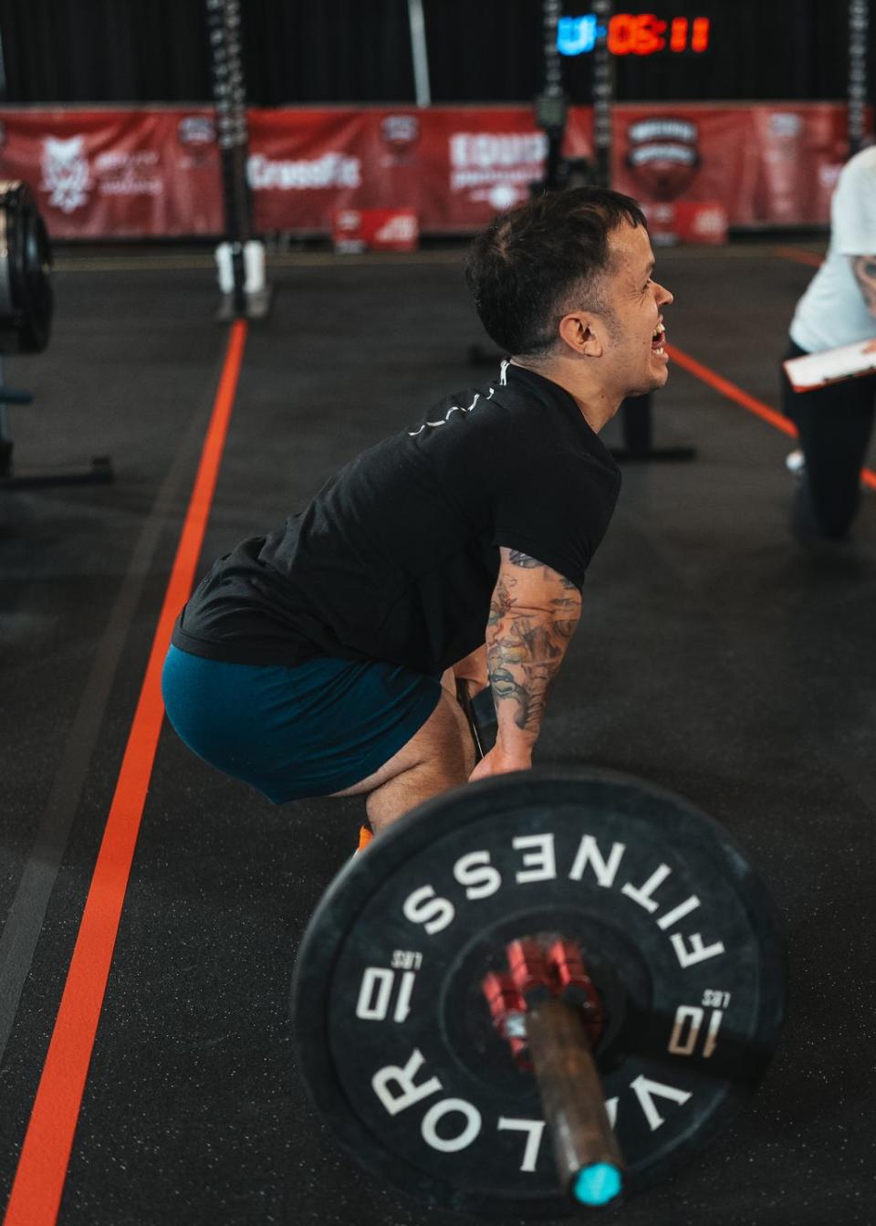 a man lifting a barbell