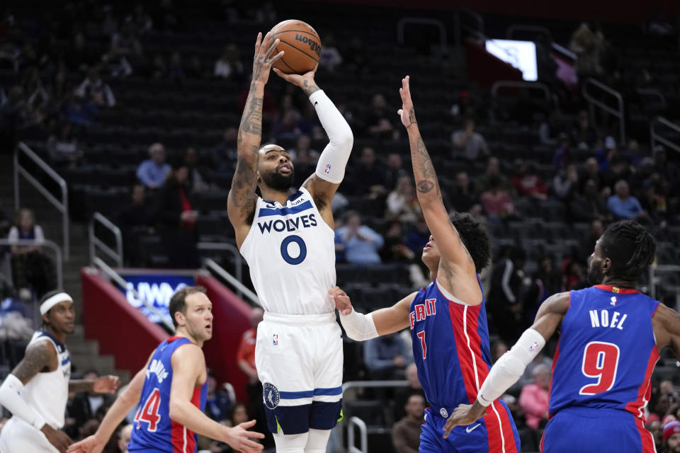 Minnesota Timberwolves guard D'Angelo Russell (0) shoots against the Detroit Pistons in the second half of an NBA basketball game in Detroit, Wednesday, Jan. 11, 2023. (AP Photo/Paul Sancya)