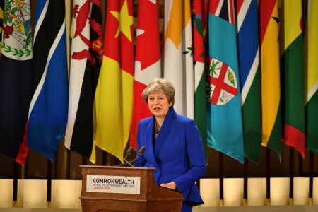 Britain's Prime Minister Theresa May speaks at the formal opening of the Commonwealth Heads of Government Meeting in the ballroom at Buckingham Palace in London, Britain, April 19, 2018. Yui Mok/Pool via Reuters
