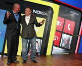 Microsoft Chief Executive Steve Ballmer (L) and his Nokia counterpart Stephen Elop introduce new Nokia phones with Microsoft's Windows 8 operating system at an event in New York in this September 5, 2012 file photo. REUTERS/Brendan McDermid/Files