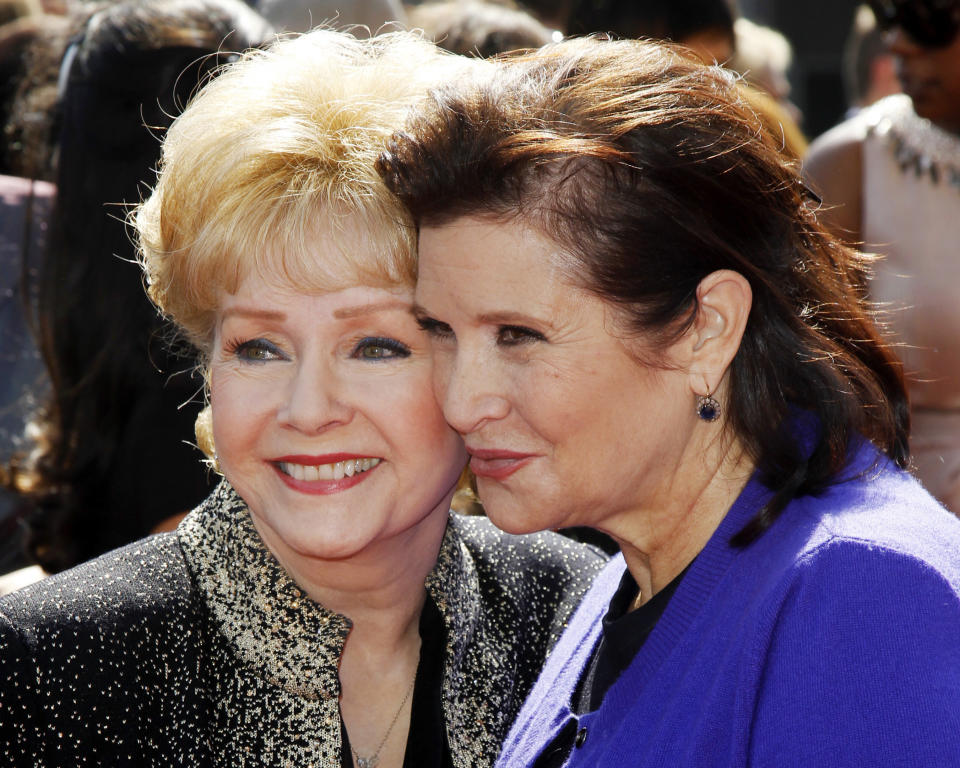 Debbie Reynolds and Carrie Fisher arrive at the Primetime Creative Arts Emmy Awards in Los Angeles on Sep.&nbsp;10, 2011.