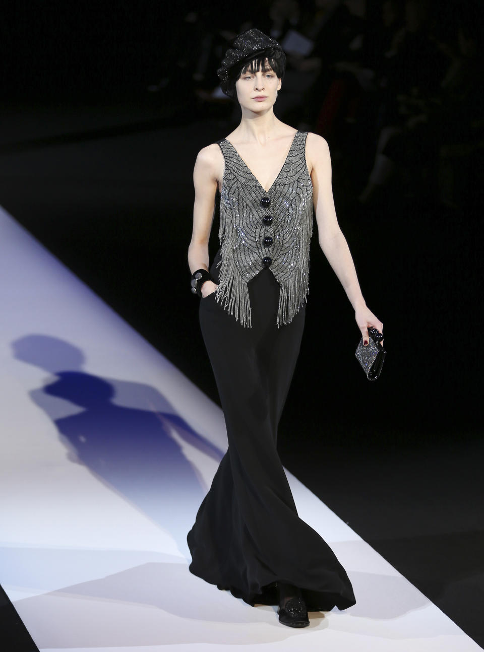 A model wears a creation for Giorgio Armani women's Fall-Winter 2013-14 collection, part of the Milan Fashion Week, unveiled in Milan, Italy, Monday, Feb. 25, 2013. (AP Photo/Antonio Calanni)