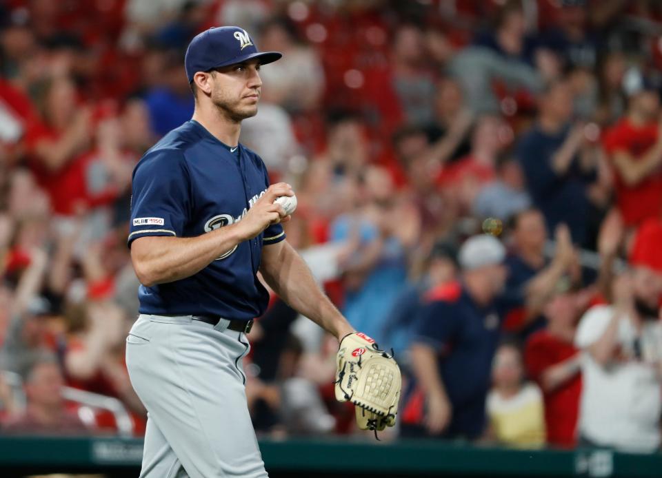 Milwaukee Brewers relief pitcher Jacob Barnes walks back to the mound after giving up an RBI-single to St. Louis Cardinals' Yadier Molina during the seventh inning of a baseball game Monday, April 22, 2019, in St. Louis. (AP Photo/Jeff Roberson) ORG XMIT: MOJR118