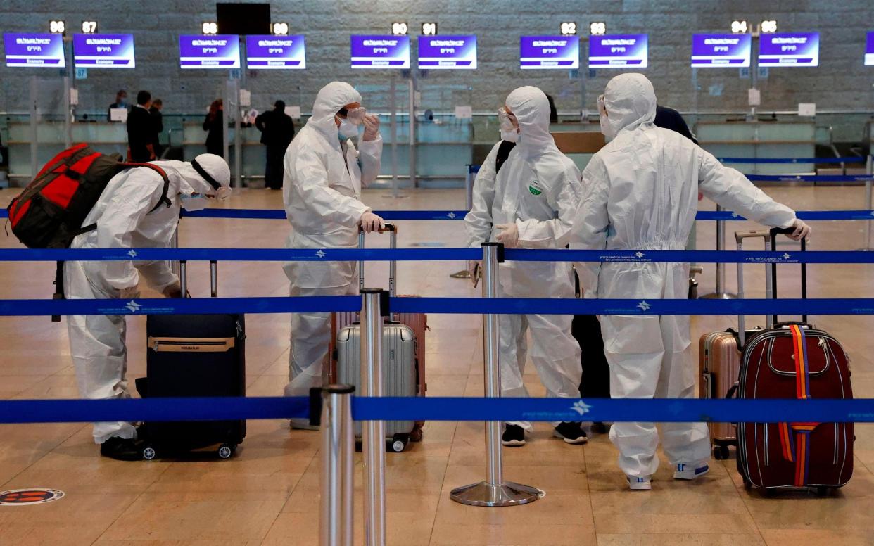 Passengers at an airport  -  Jack Guez/ AFP via Getty Images