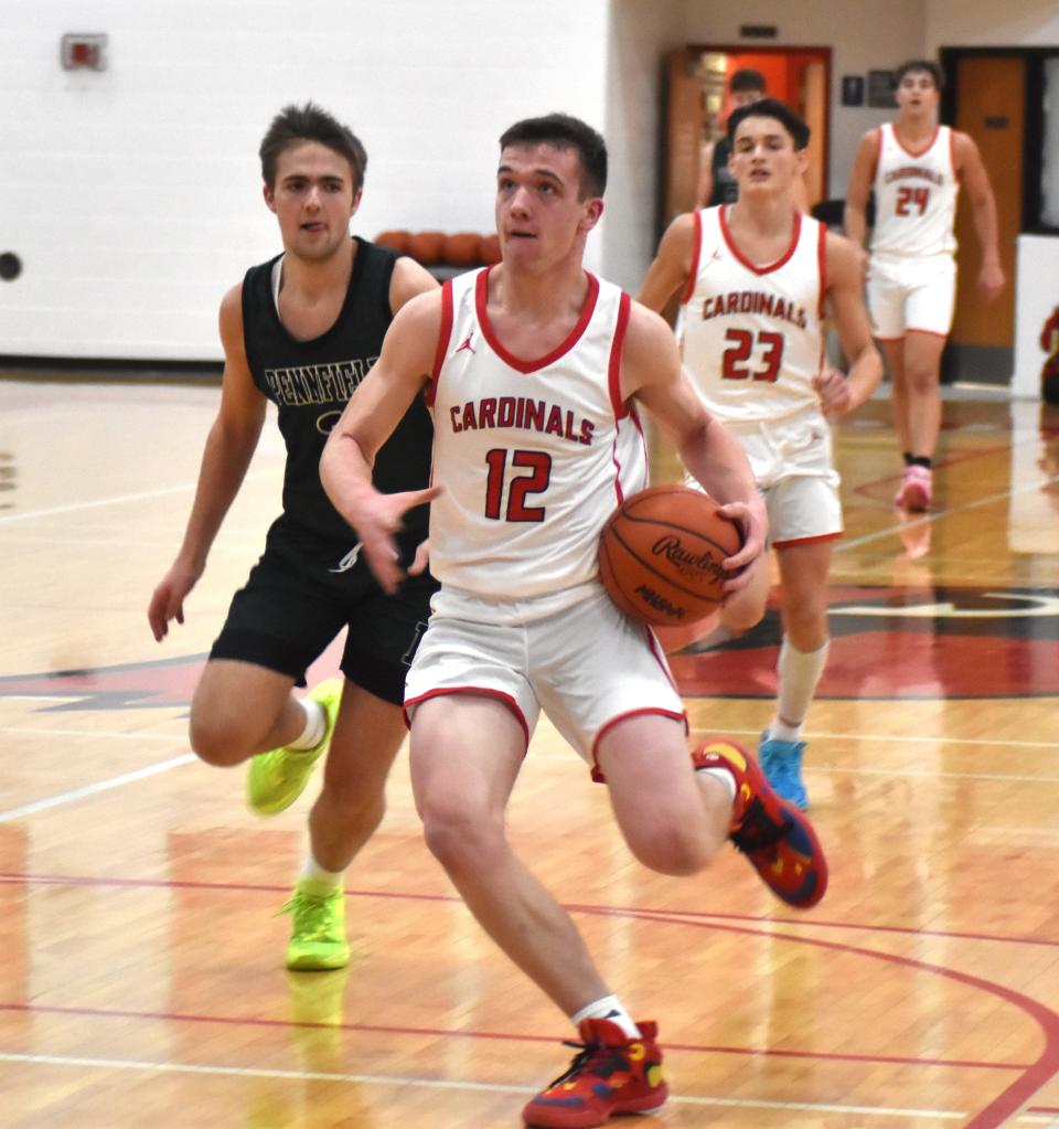 Coldwater junior Zach Coffing (12) looks for two in transition versus Pennfield Friday night