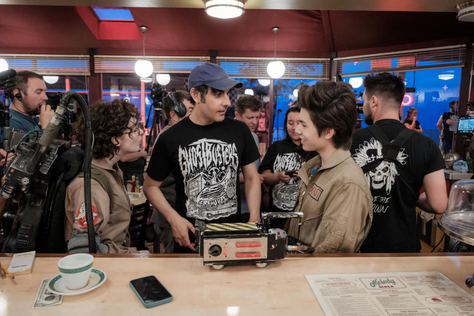 Mckenna Grace,with director Gil Kenna and Logan Kim on the set of the new Ghostbusters film. (Sony Pictures)