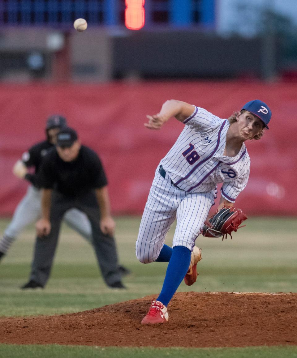 Starter Walter Ford (18) pitches during the Tate vs Pace baseball game at Pace High School on Friday, April 15, 2022.