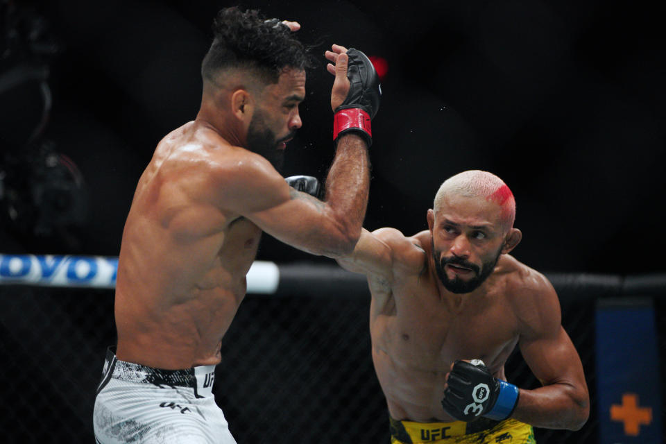 Dec 2, 2023; Austin, Texas, USA; Rob Front (red gloves) fights Deiveson Figueiredo (blue gloves) during UFC Fight Night at Moody Center. Mandatory Credit: Dustin Safranek-USA TODAY Sports