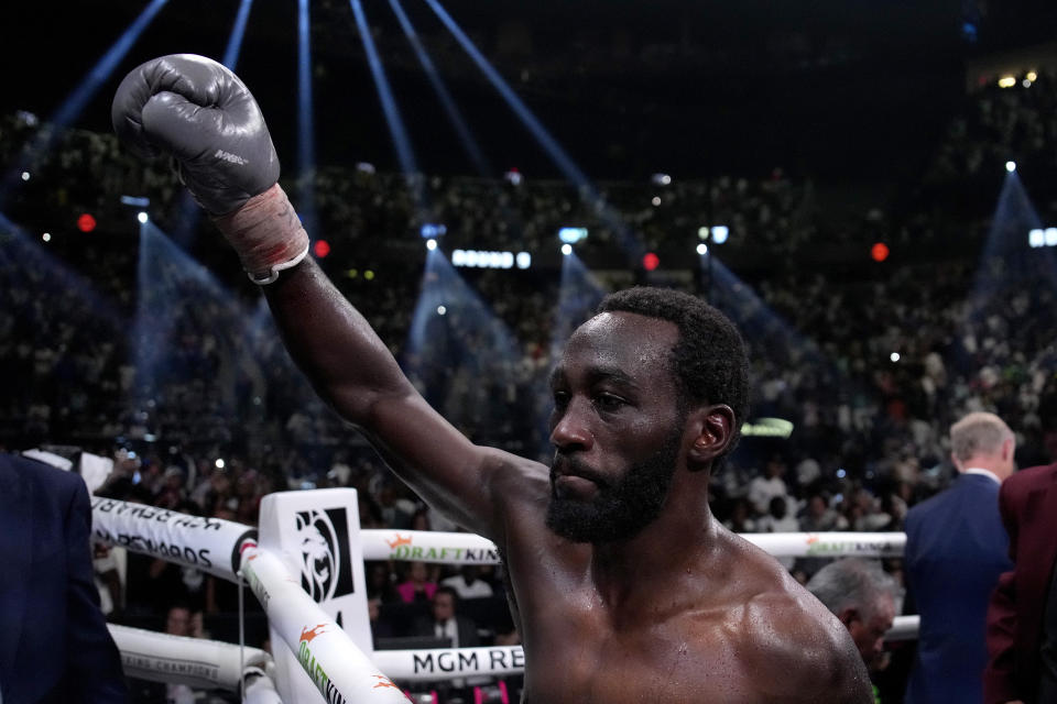 Terence Crawford celebrates his undisputed welterweight championship boxing match win over Errol Spence Jr., Saturday, July 29, 2023, in Las Vegas. (AP Photo/John Locher)