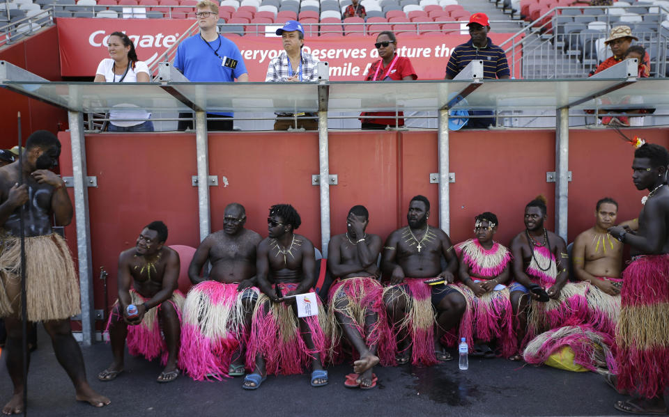 Dancers wearing traditional dress rest after performing at a cultural show as part of APEC 2018 activities at Port Moresby, Papua New Guinea on Friday, Nov. 16, 2018. The APEC Papua New Guinea 2018, is the official hosting of Asia-Pacific Economic Cooperation (APEC) meetings. (AP Photo/Aaron Favila)