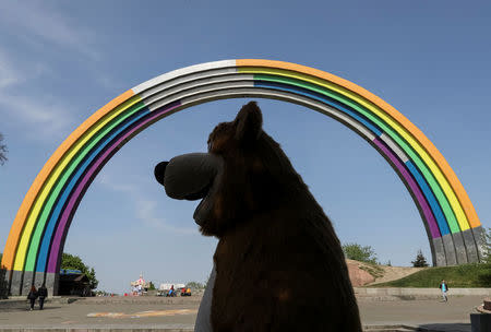 A Soviet monument, "Arch of the Friendship of Nations", painted with rainbow colours, in celebration of diversity ahead of the Eurovision Song Contest, is seen in central Kiev, Ukraine May 4, 2017. REUTERS/Gleb Garanich