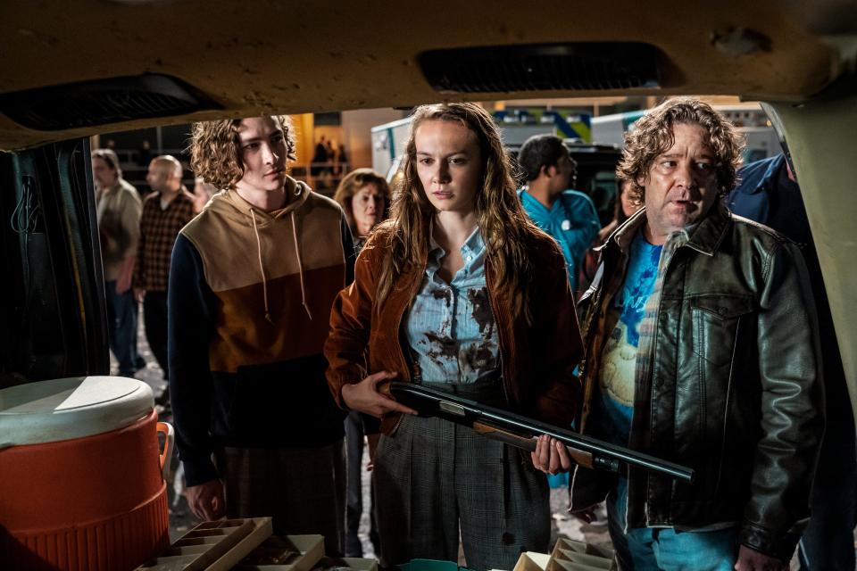 Allyson (Andi Matichak, center, with Dylan Arnold and Robert Longstreet) joins the local posse formed to hunt down Michael Myers in "Halloween Kills."