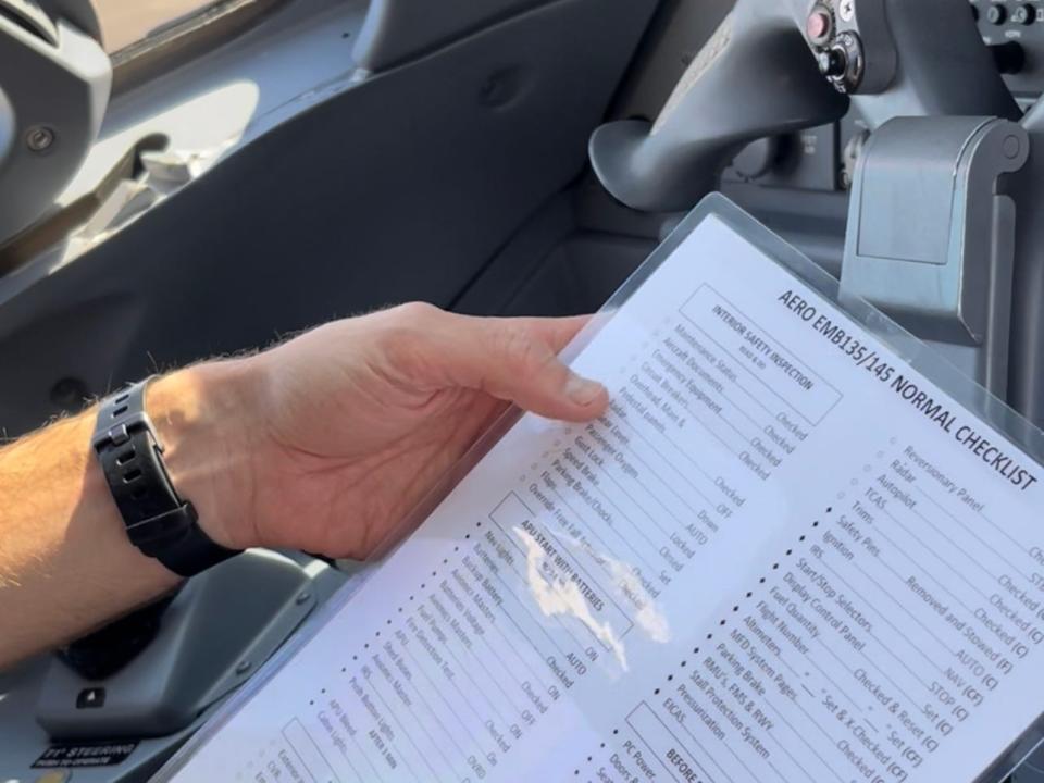 Reviewing the pre-flight checklist.