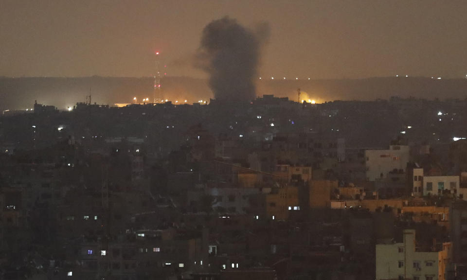 An explosion caused by Israeli airstrikes is seen in Gaza City, early Thursday, Nov. 14, 2019. Israeli aircraft struck Islamic Jihad targets throughout the Gaza Strip on Wednesday while the militant group rained scores of rockets into Israel for a second straight day as the heaviest round of fighting in months showed no signs of ending. (AP Photo/Adel Hana)