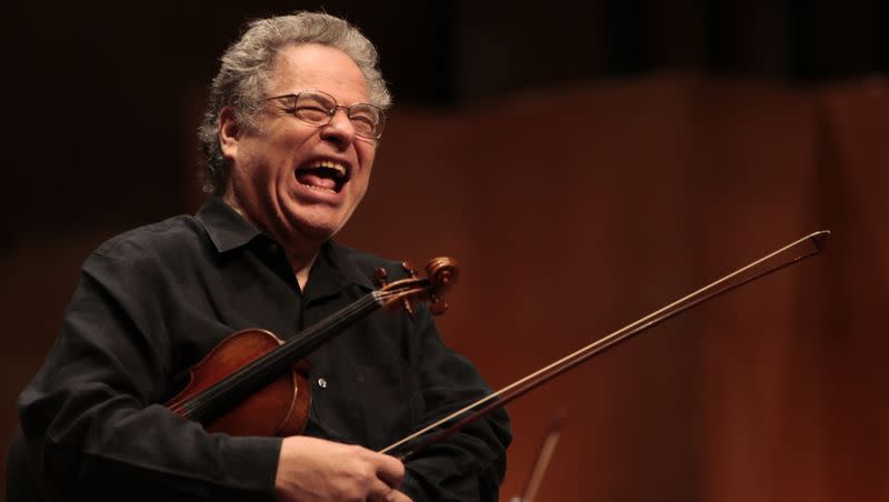 Violinist Itzhak Perlman laughs during rehearsal at Teresa Carreno theater in Caracas, Venezuela, on  June 2, 2009. Perlman recently performed at BYU for the second time in his decadeslong career.