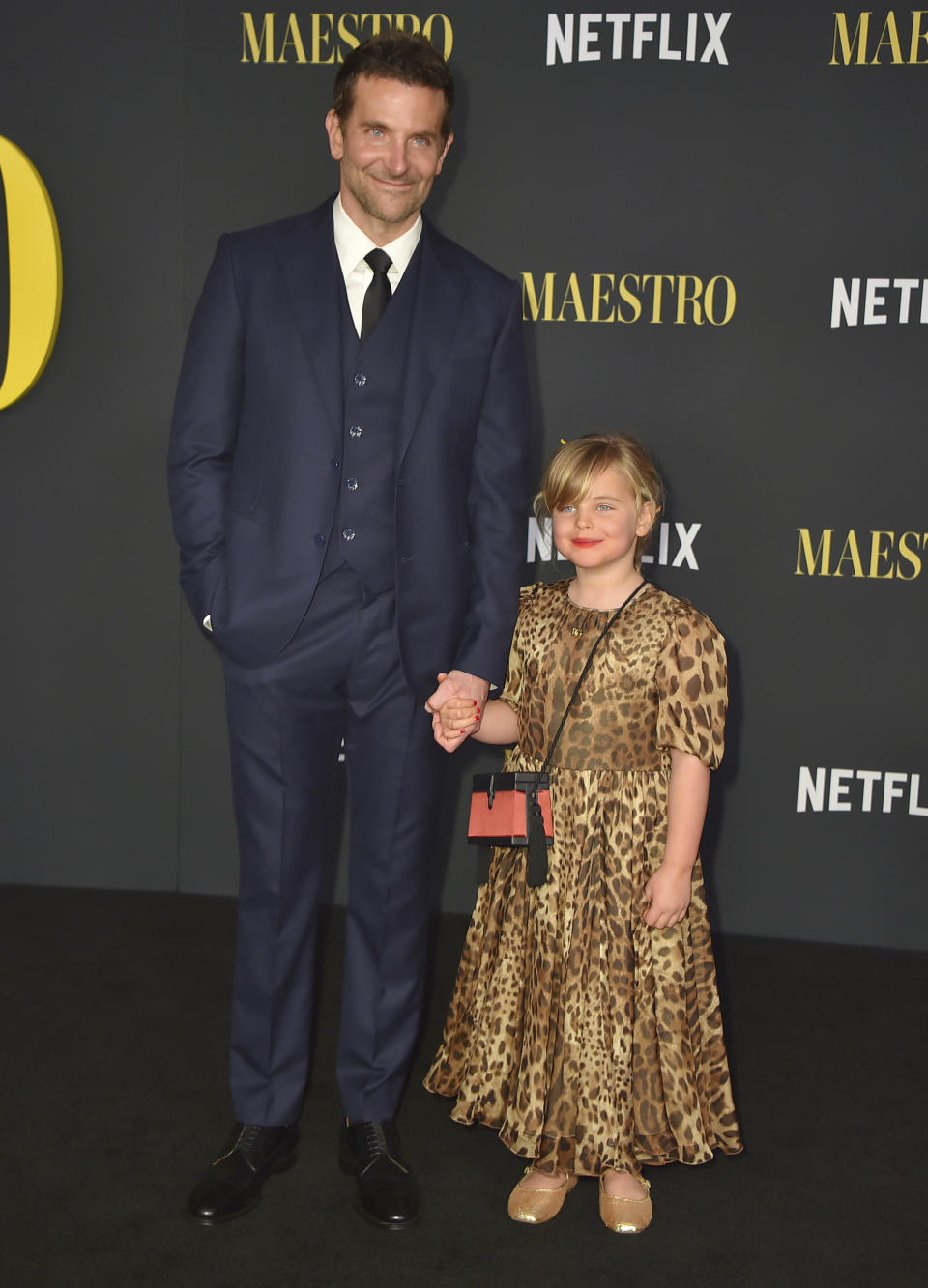 Bradley Cooper, left, and his daughter Lea De Seine Shayk Cooper arrive at a special screening of "Maestro" on Tuesday, Dec. 12, 2023, at the Academy Museum of Motion Pictures in Los Angeles. (Photo by Jordan Strauss/Invision/AP)