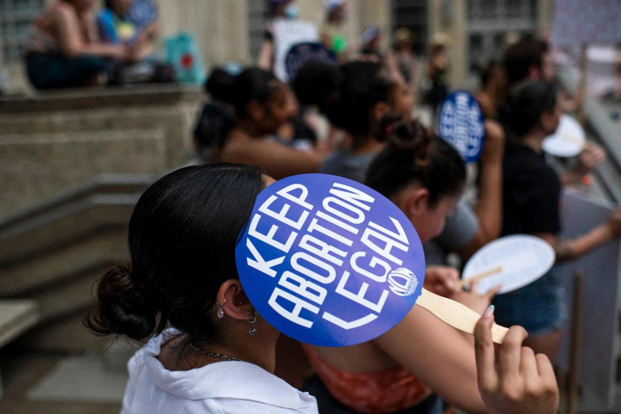 <span>Abortion rights supporters rally in Houston, Texas, on 14 May 2022.</span><span>Photograph: Mark Felix/AFP via Getty Images</span>