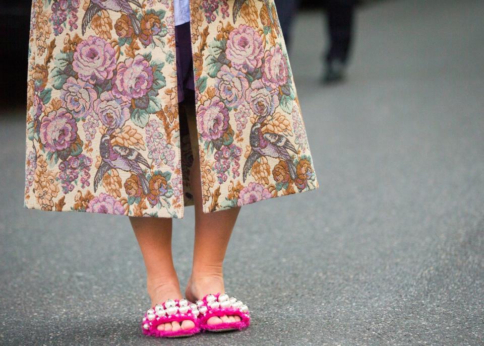 Stylist Katie Grand wears grandma’s tapestry coat with Miu Miu slippers.