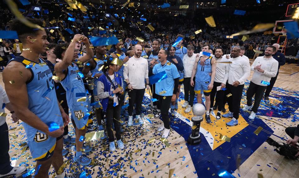 The Marquette Golden Eagles celebrate winning the 2023 Big East regular season title.