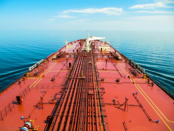 A red-orange oil tanker deck on a blue ocean