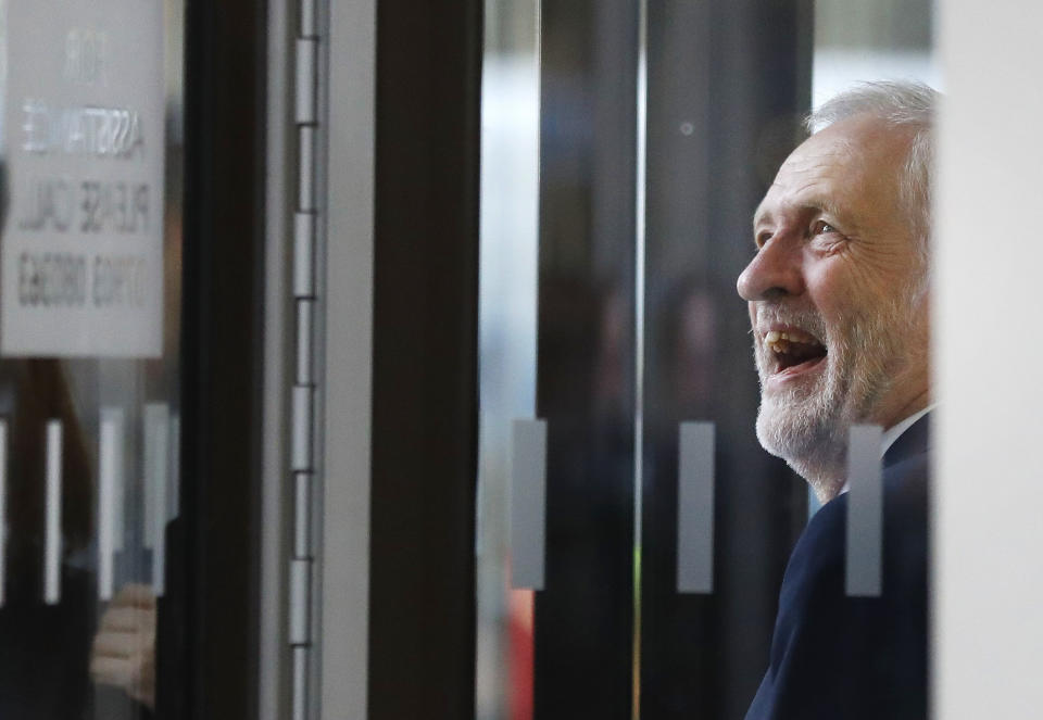 FILE - In this Friday, June 9, 2017 file photo Britain's Labour party leader Jeremy Corbyn smiles as he arrives at Labour party headquarters in London. (AP Photo/Frank Augstein, File)
