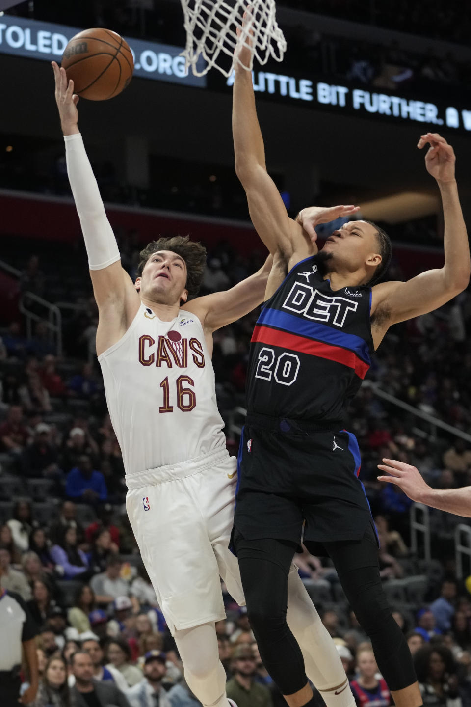 Cleveland Cavaliers forward Cedi Osman (16) drives on Detroit Pistons forward Kevin Knox II (20) in the first half of an NBA basketball game in Detroit, Friday, Nov. 4, 2022. (AP Photo/Paul Sancya)