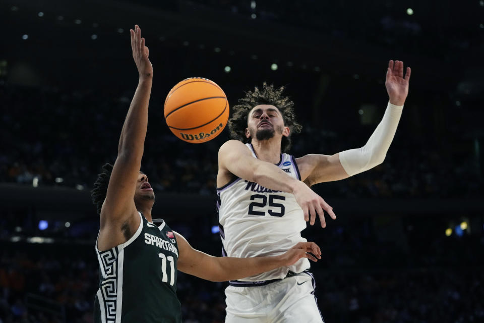 Kansas State forward Ismael Massoud (25) swats the ball away from Michigan State guard A.J. Hoggard (11) in the first half of a Sweet 16 college basketball game in the East Regional of the NCAA tournament at Madison Square Garden, Thursday, March 23, 2023, in New York. (AP Photo/Frank Franklin II)