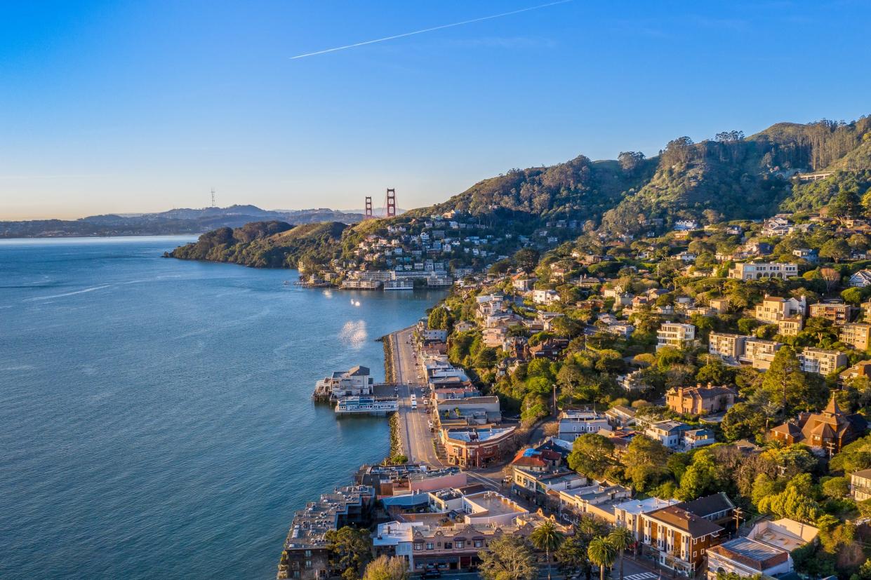 An aerial view of the Bay Area with the Golden Gate Bridge in the background