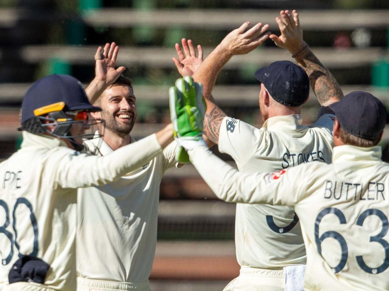 Mark Wood celebrates after taking the wicket of Quinton de Kock: AP