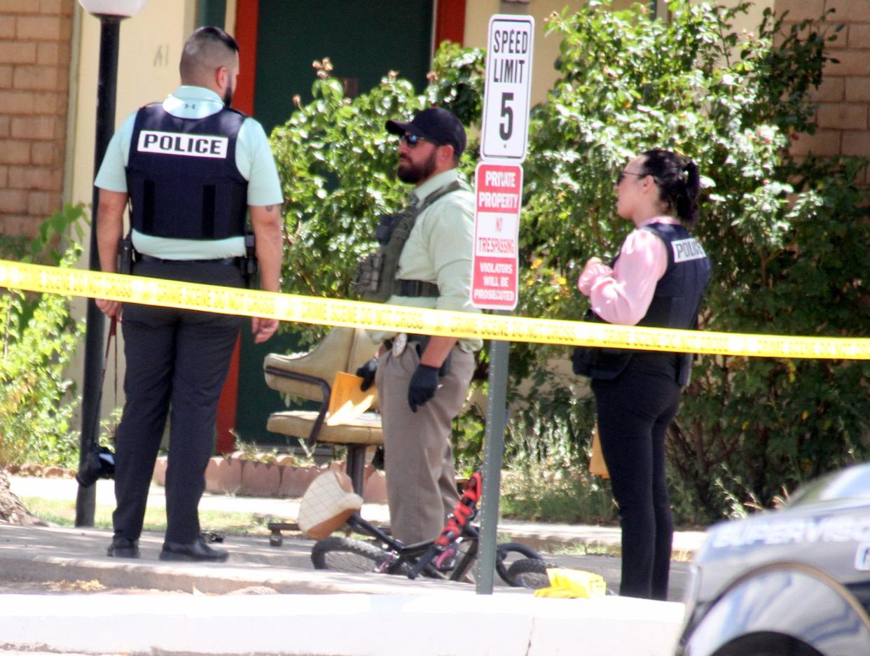 Deming police investigators process the scene of a June 13, 2022 shooting at the Deming Manor Apts.