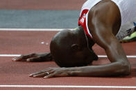 Britain's Mo Farah reacts after winning the men's 10,000m final at the London 2012 Olympic Games at the Olympic Stadium August 4, 2012. REUTERS/Kai Pfaffenbach (BRITAIN - Tags: OLYMPICS SPORT ATHLETICS)